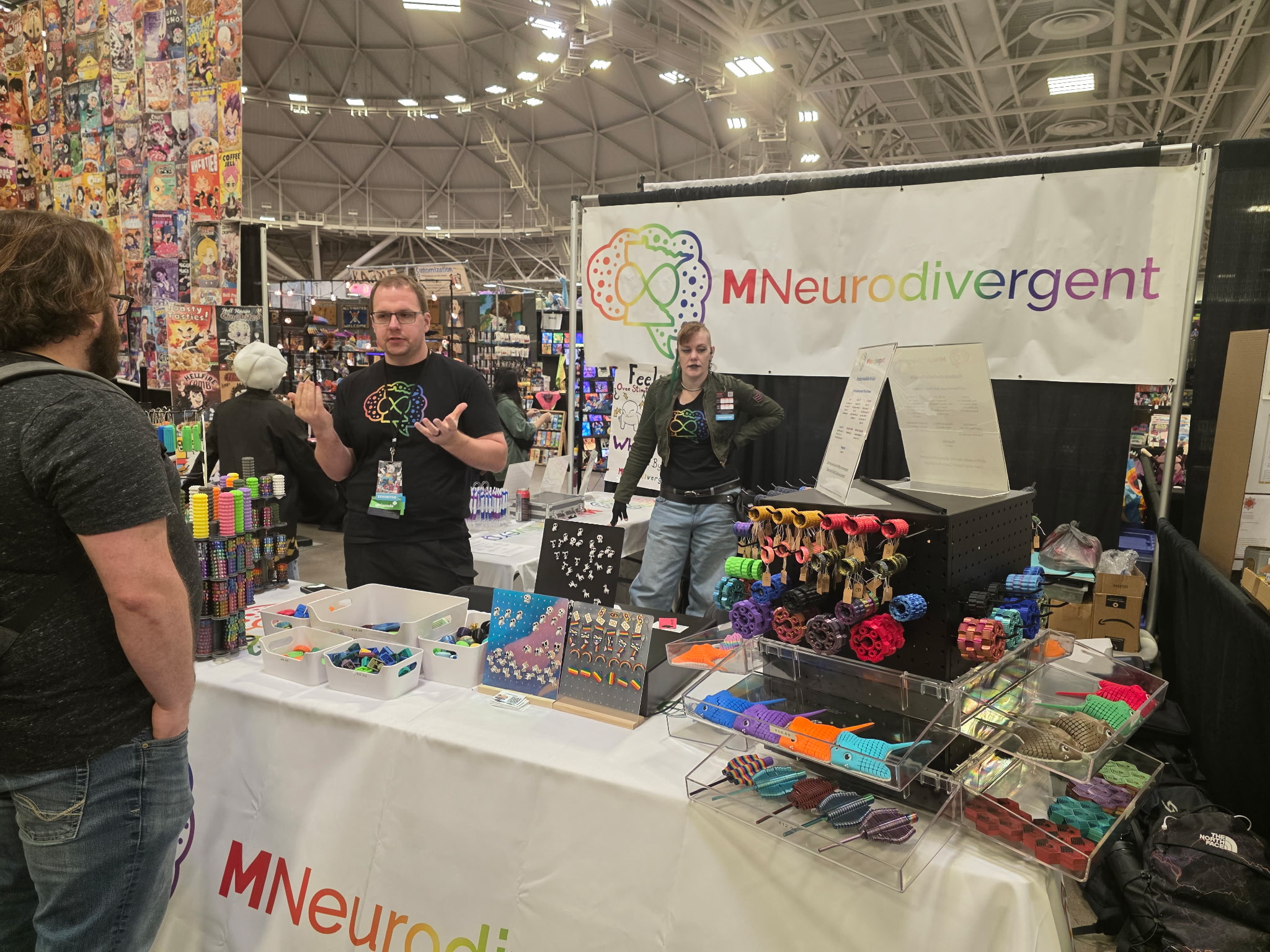MNeurodivergent tabling display at Twin Cities Con.